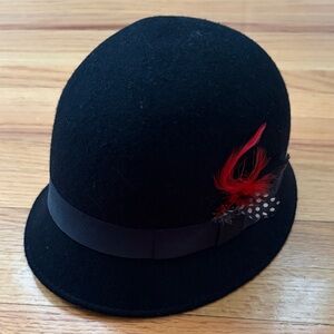 Elegant Black Hat with Red Feather Accent